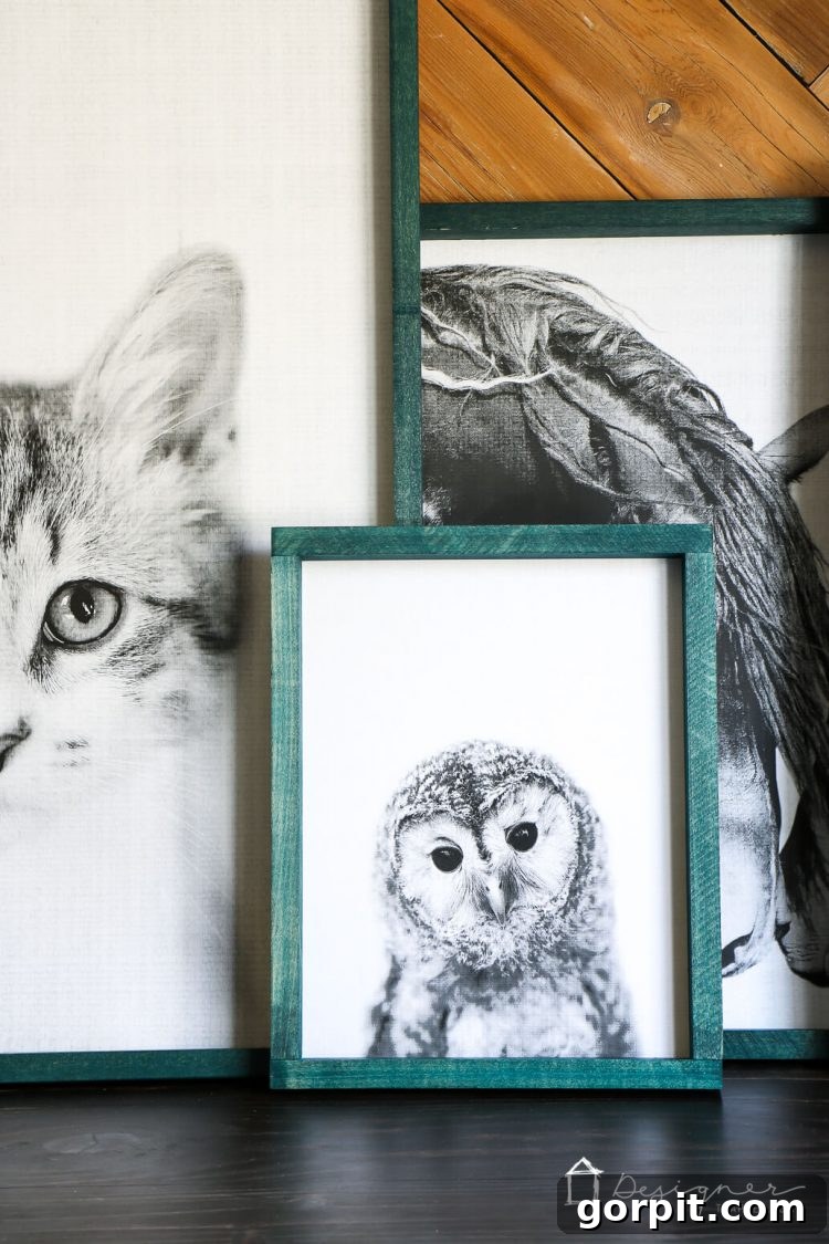 Three custom-framed engineer prints, showcasing the simple yet elegant design of the DIY large wall art, mounted in a children's bedroom.