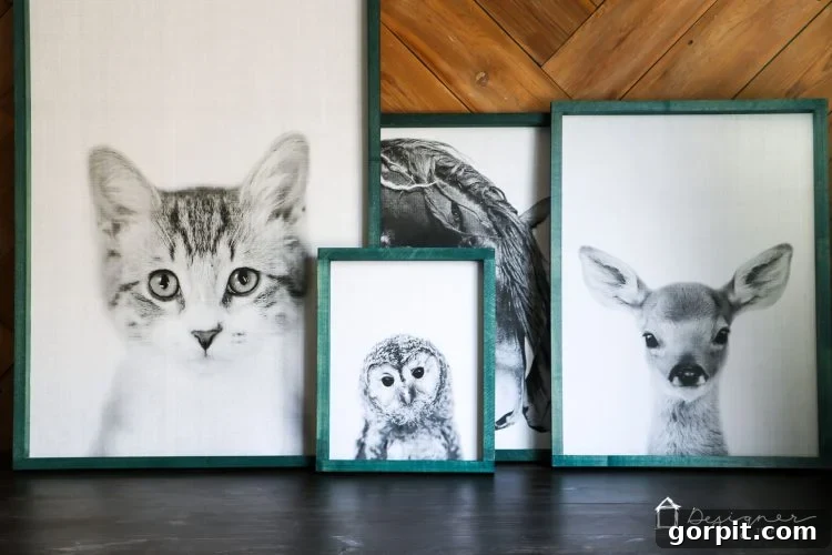 Close-up of one of the DIY large wall art frames with a charming animal illustration, highlighting the vibrant blue stain.