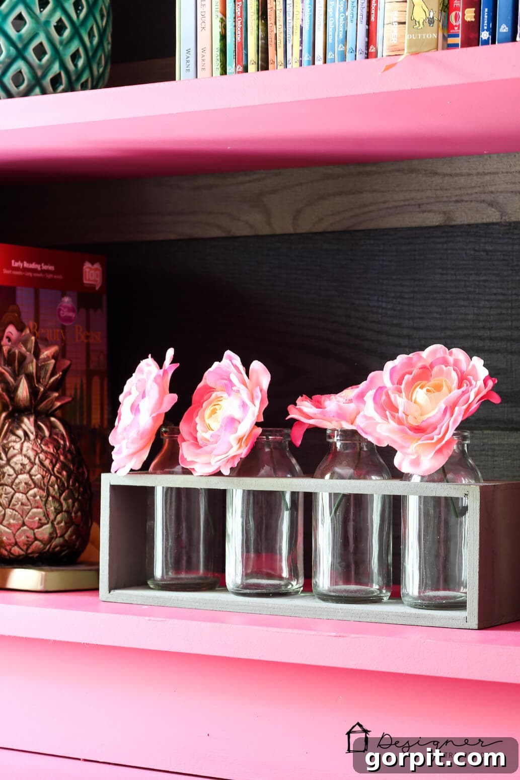 Unlock Massive Storage Potential with an IKEA Billy Hack 10 An IKEA Billy bookcase shelf close-up on a brass pineapple and small bottle with pink flowers.