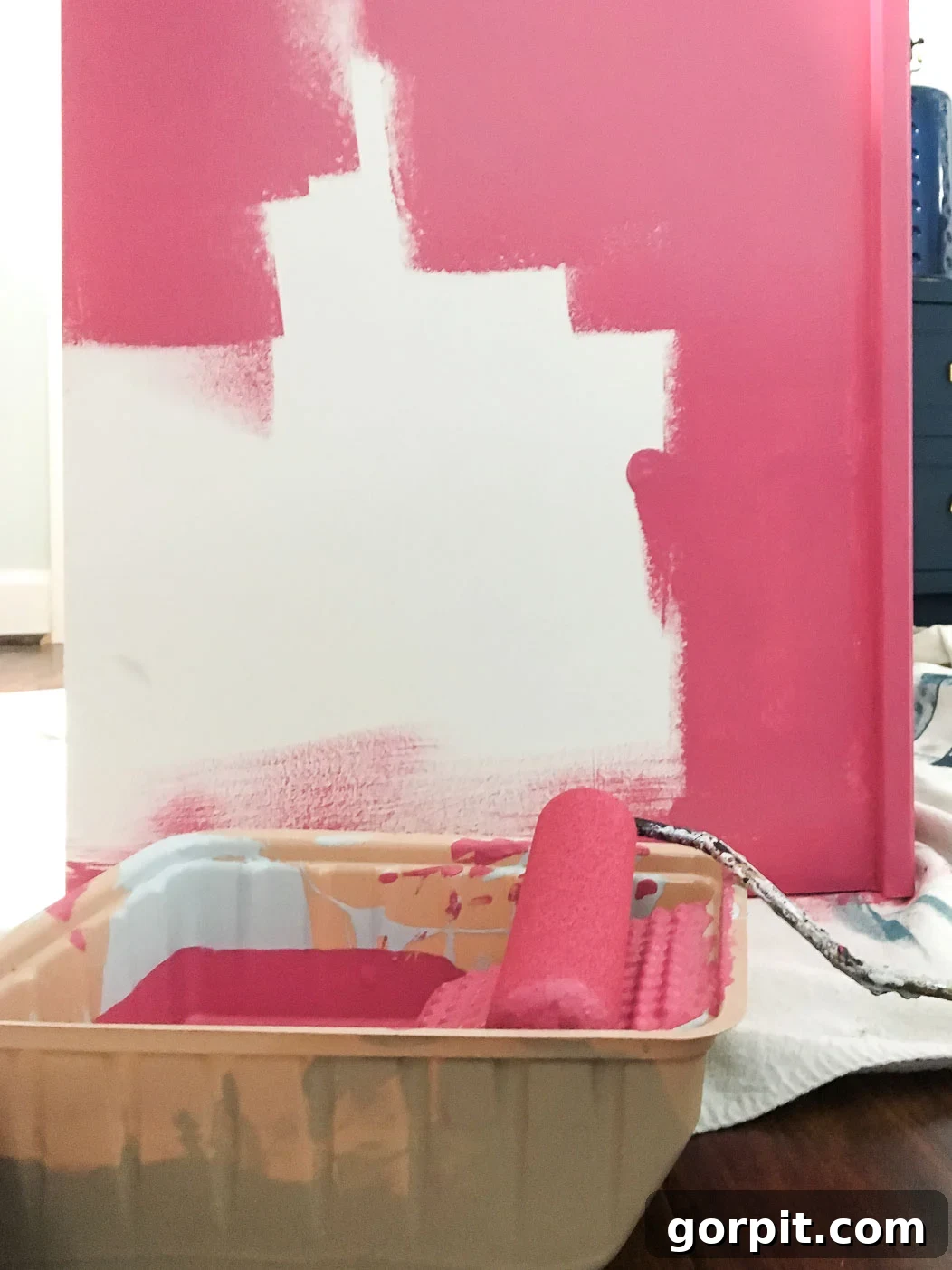Your Ultimate Guide to Painting IKEA Furniture Without Mistakes 6 Someone painting an IKEA laminate furniture piece a vibrant pink color