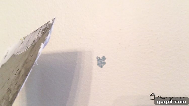 Repair any minor paint damage after decal removal for a flawless base for your new wall quote.