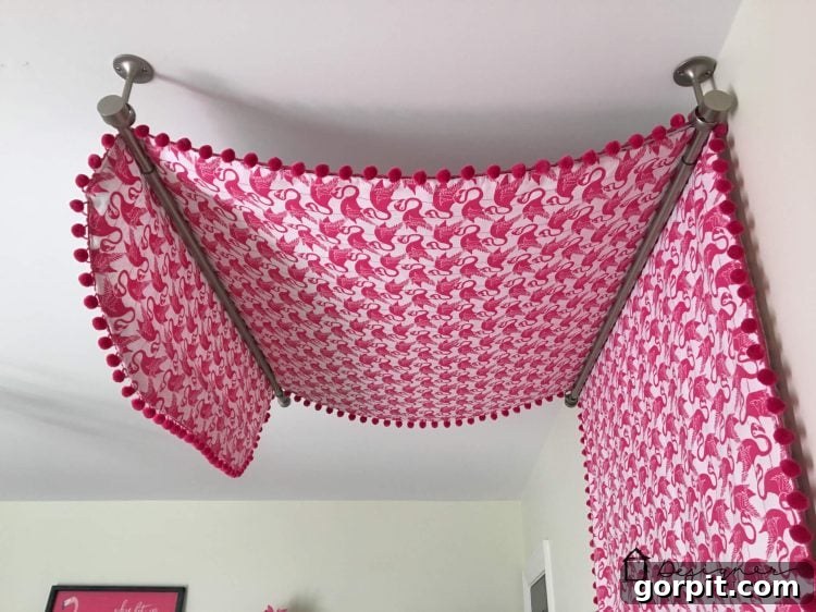 Flat Sheet Bed Canopy: Your Cozy Oasis 9 Installing two ceiling-mounted curtain rods to create the structure for a DIY bed canopy, showing the elegant drape.