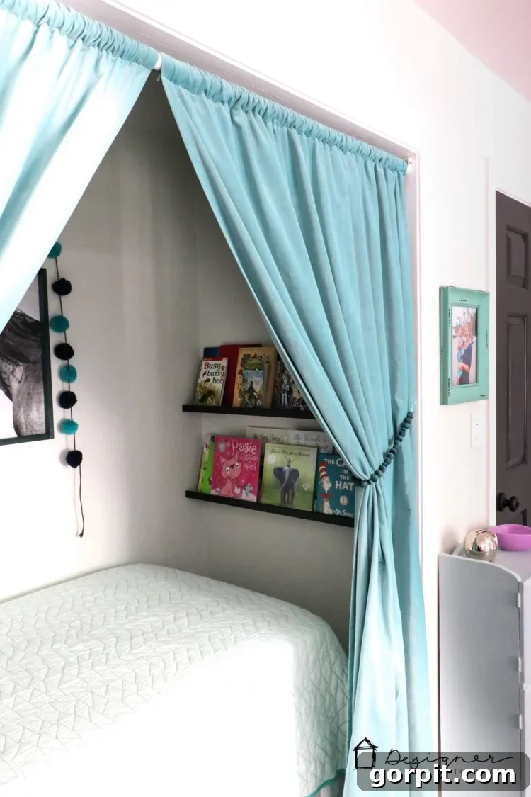A side view of a curtain elegantly tied back with a blue wood bead holdback in a child's bedroom.