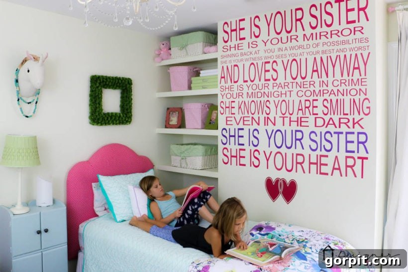 little girls laying on bed in colorful room