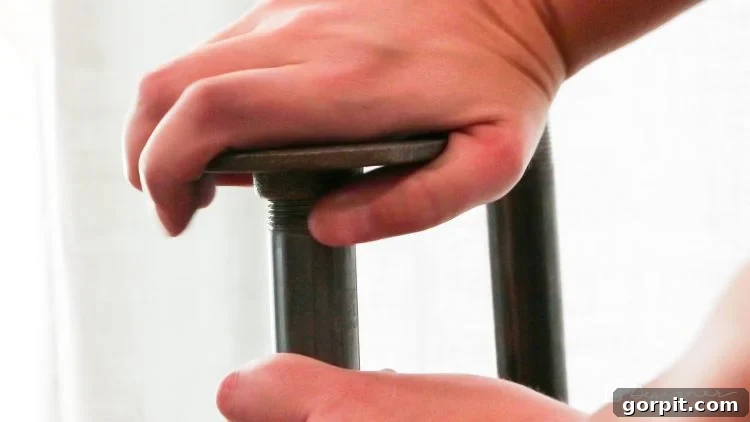 The remaining four steel floor flanges are screwed onto the bottom ends of the steel pipes.