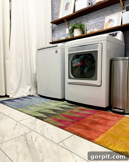 Luxury vinyl tile designed to look like elegant marble, installed beautifully in a laundry room, showcasing a durable and affordable flooring solution.