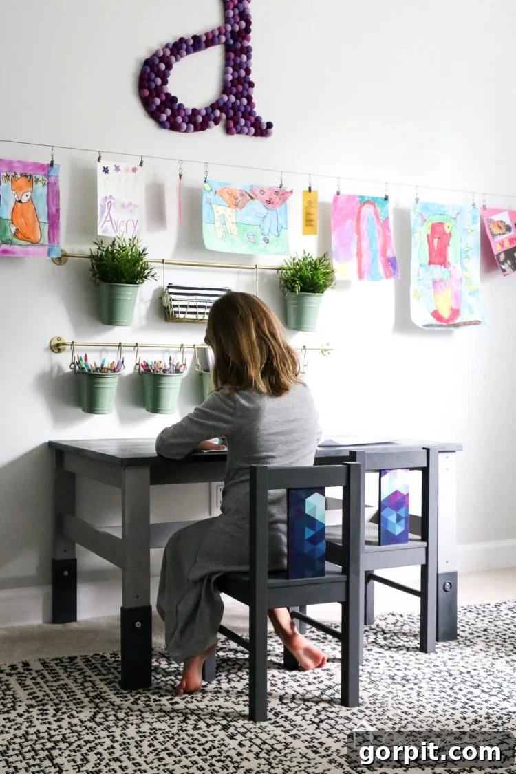 Full view of the transformed IKEA kids table and chairs, demonstrating how a budget-friendly piece can achieve a designer aesthetic.
