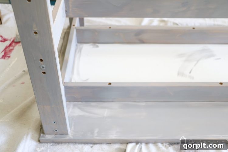 The IKEA Kritter table with two-tone gray paint, showcasing the blend of dark and light chalk paint colors.