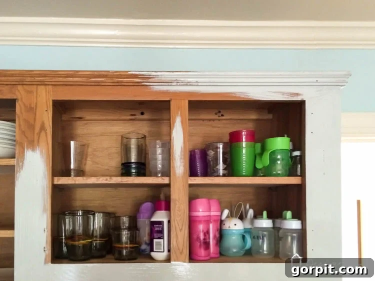 Close-up of DIY painted kitchen cabinets, showcasing the finish.
