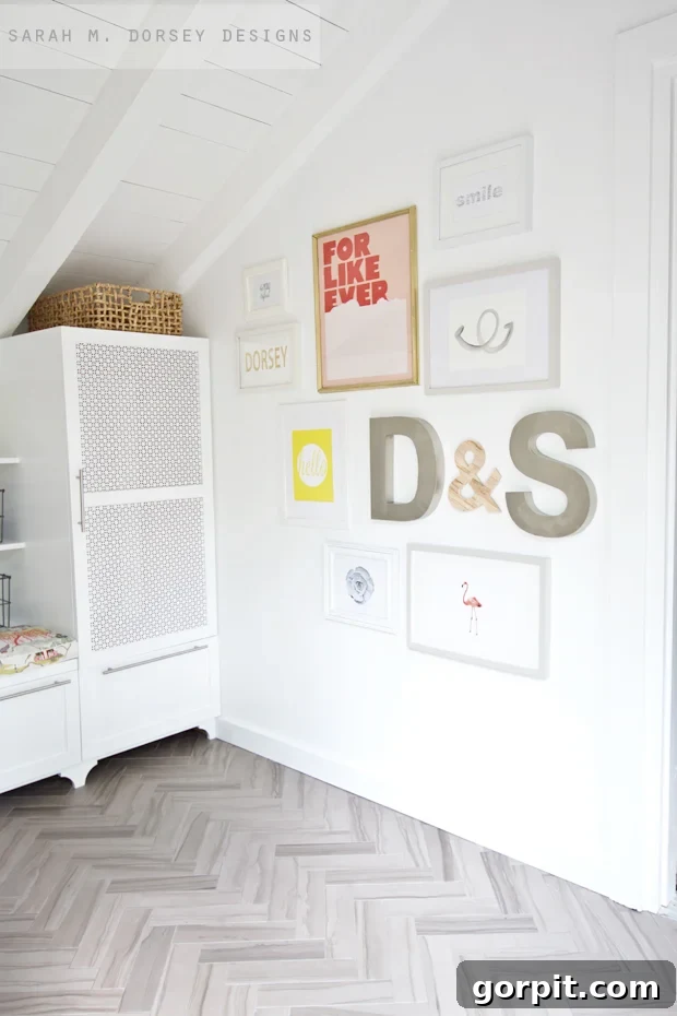 Gallery wall in entryway of modern home with dimensional initial letters