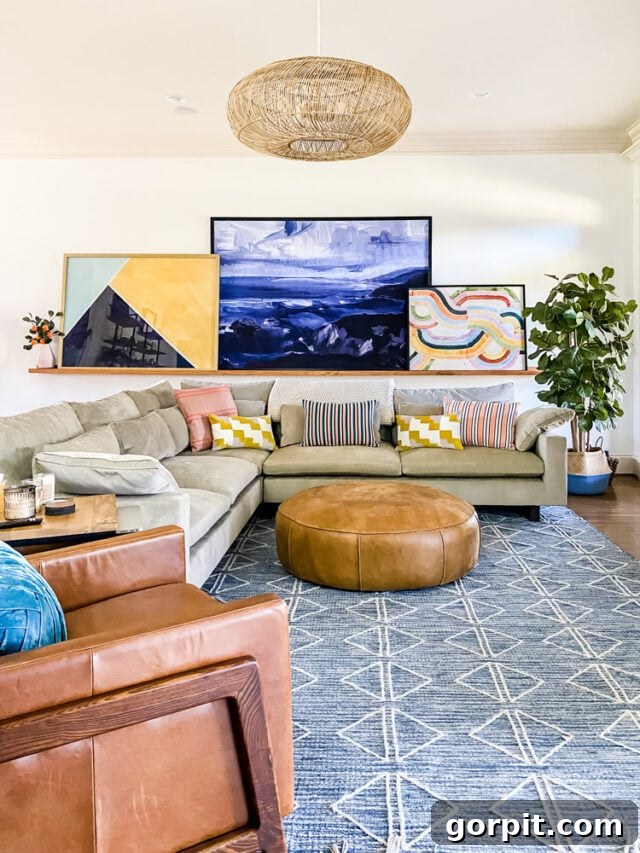 Oversized art gallery on a DIY art ledge in a family room