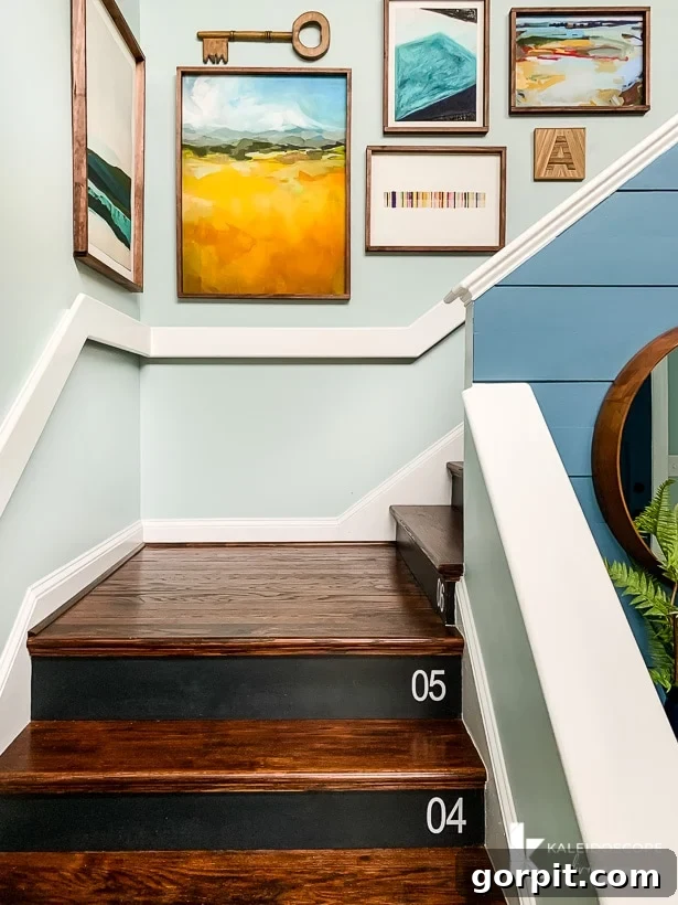 Wood staircase with colorful art arrangement and DIY frames