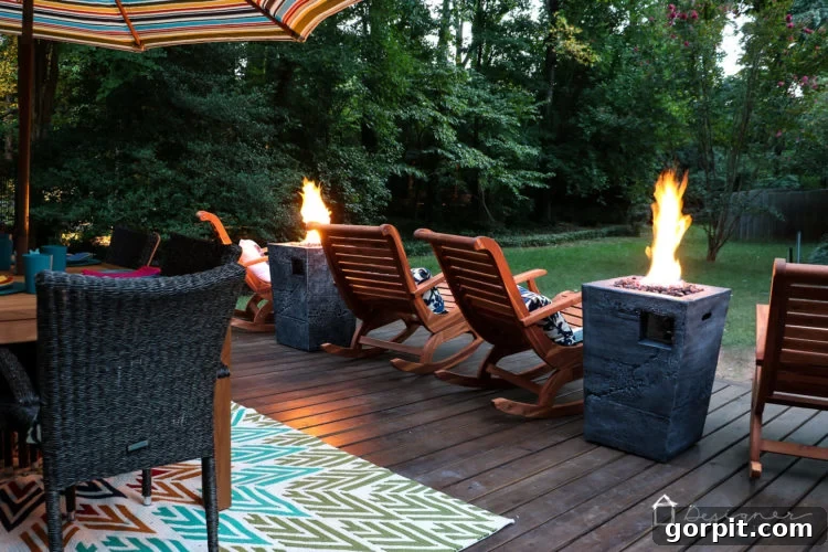 Detailed view of one of the fire columns, showcasing its design and the beautiful flickering flame, adding a focal point to the deck.