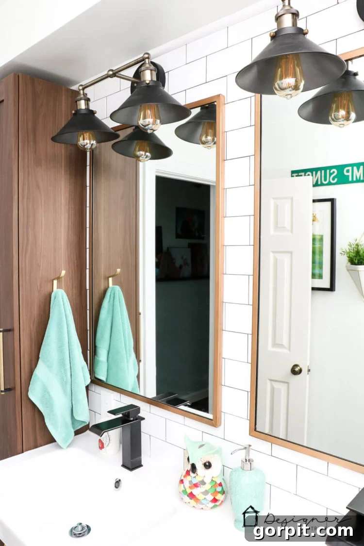 Another perspective of the transformed gold mirror, emphasizing how Rub N Buff elevates a basic item into a decor statement.