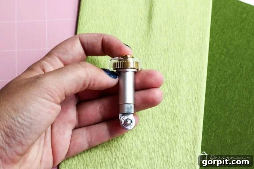 Cricut's Edge: Crafting Impeccable Crepe Paper Succulents 4 The revolutionary Cricut Maker Rotary Blade, essential for cutting delicate materials like crepe paper and various fabrics.