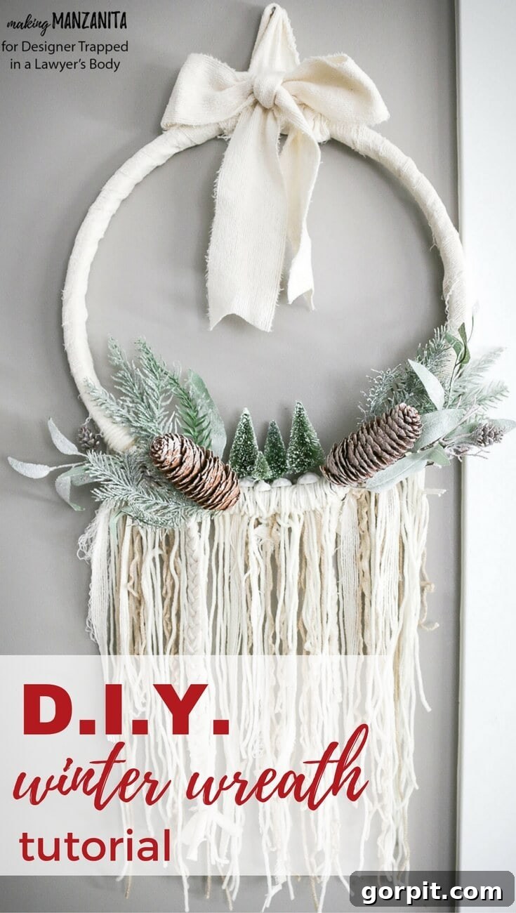 Close-up of a finished DIY Boho Winter Wreath with neutral fabrics and sisal trees