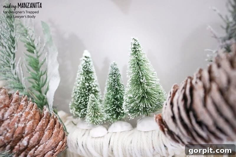Detailed view of the DIY Boho Winter Wreath's fabric, yarn, and sisal tree embellishments
