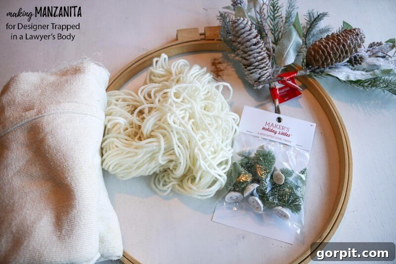 A selection of supplies laid out, ready to make a DIY boho winter wreath
