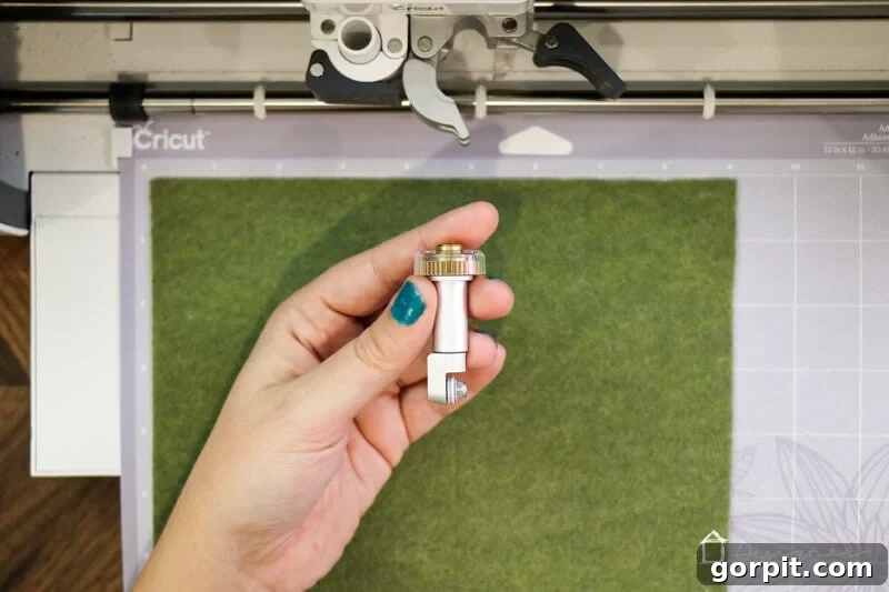 Warm & Fuzzy Holidays: Crafting One-of-a-Kind Felt Ornaments 3 Cutting felt for DIY Christmas ornaments using a Cricut Maker for precision and ease, ensuring clean edges for your handmade holiday decor.