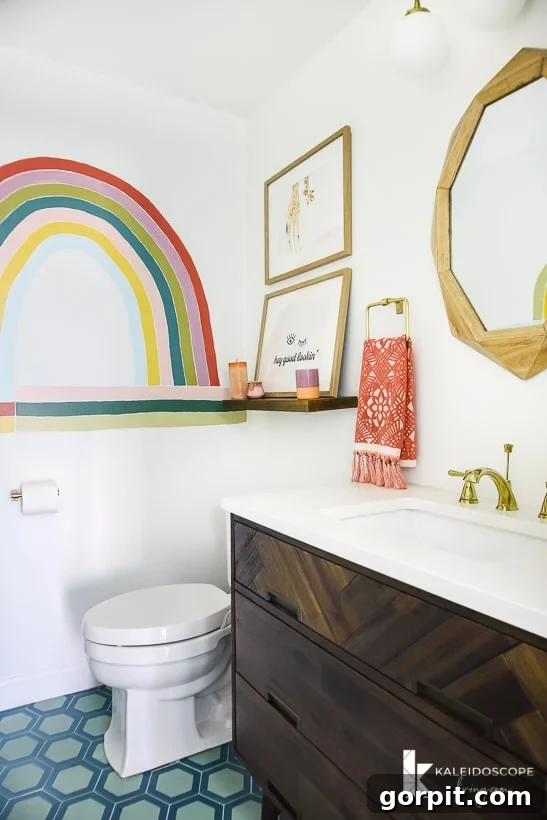 Make Small Rooms Feel Bigger 9 Genius Hacks 12 A bathroom with a large painted rainbow and blue honeycomb-patterned floor.