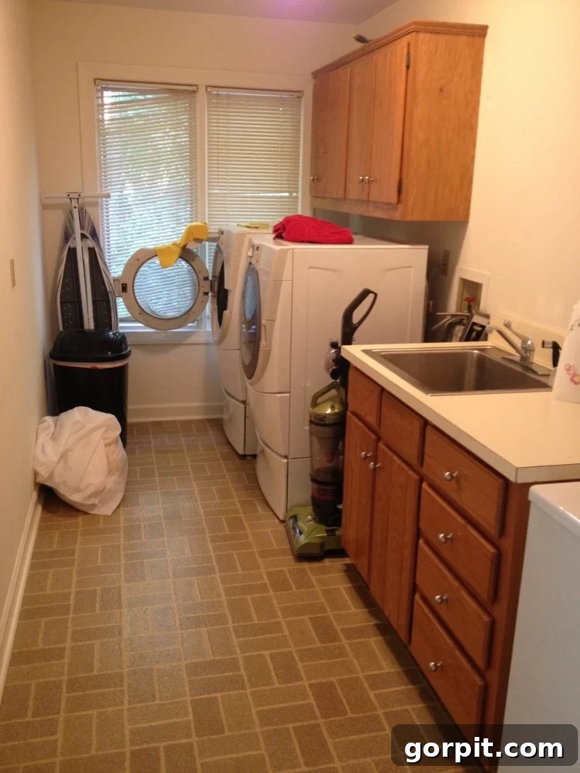 Make Small Rooms Feel Bigger 9 Genius Hacks 14 A first-floor laundry room is darker and looks smaller with windows covered by old blinds.
