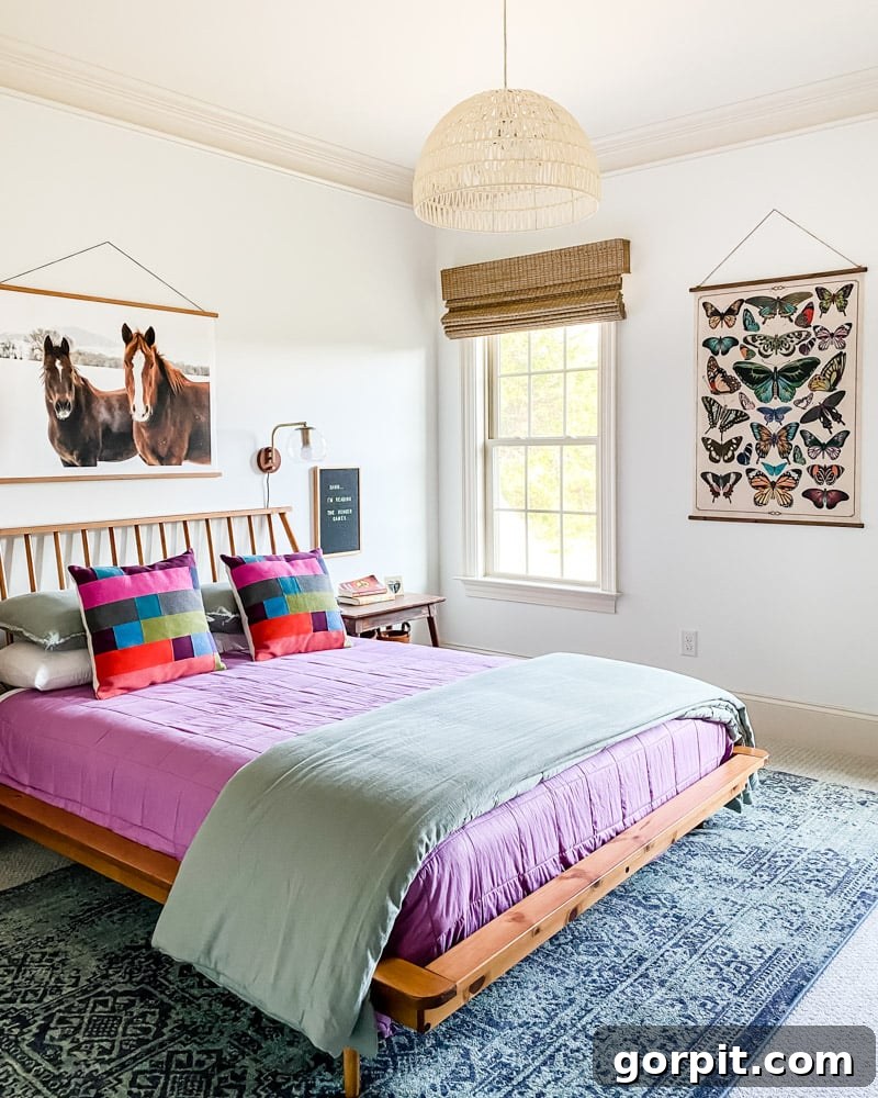 Make Small Rooms Feel Bigger 9 Genius Hacks 16 A large picture of horses and a large butterfly piece of art make a girl's small room look bigger.