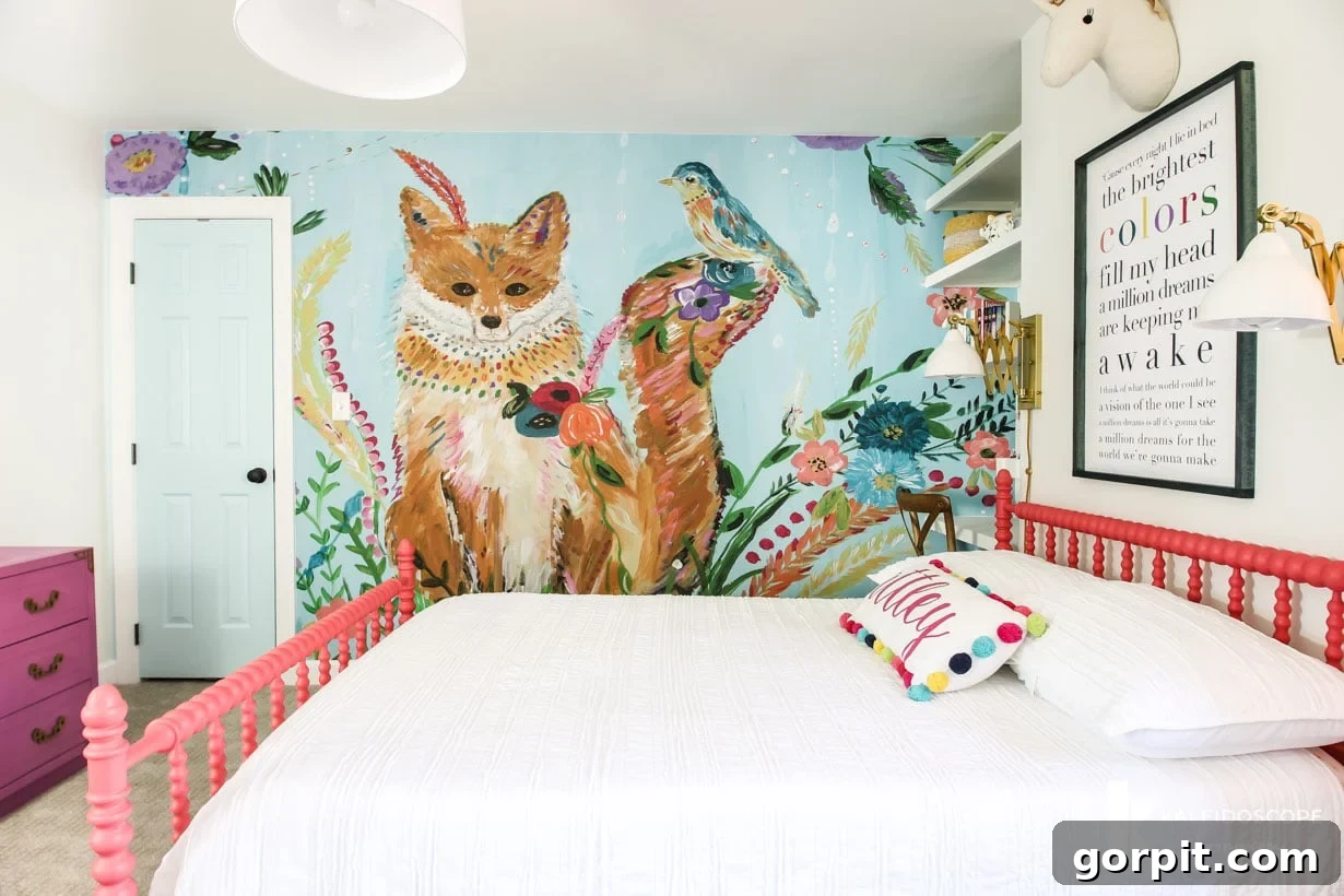 Make Small Rooms Feel Bigger 9 Genius Hacks 17 A tween girl's bedroom has a pink bedframe and a large mural of a fox and birds.