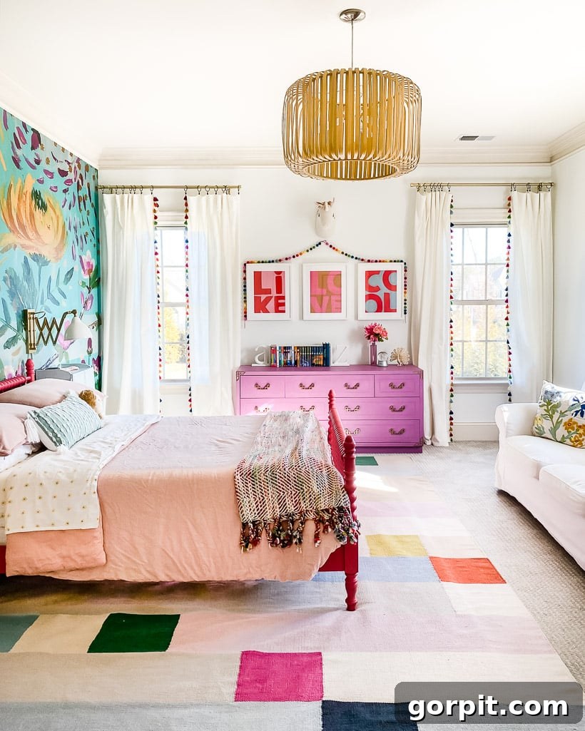 Make Small Rooms Feel Bigger 9 Genius Hacks 4 A bright colorful tween girl's bedroom with high white tasseled curtains that make a small room look bigger.