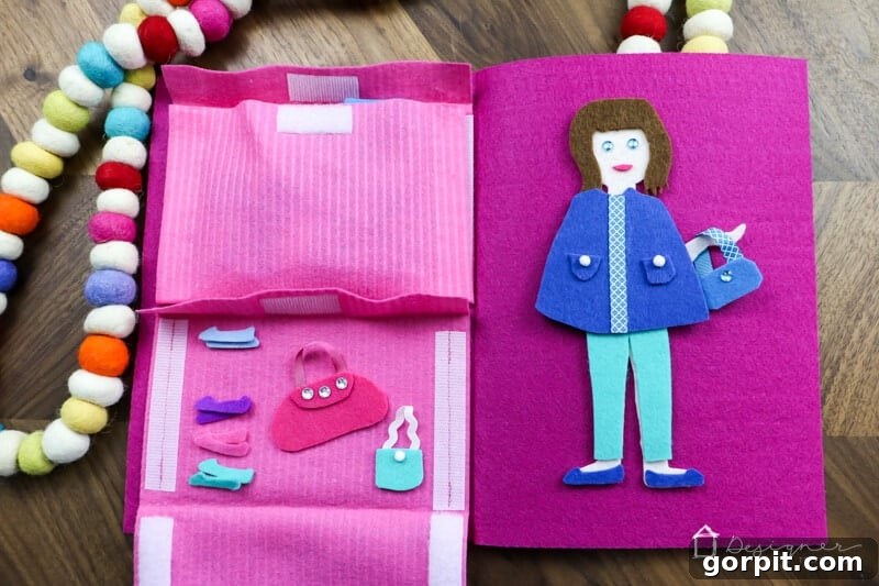Creative Felt Doll Kit 11 Close-up of the organized pockets within the DIY felt doll kit, showing clothes in the top and shoes/accessories in the bottom.