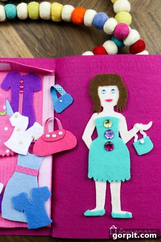 Creative Felt Doll Kit 13 A beautiful felt doll with an array of her handmade clothes spread around, inviting imaginative play.
