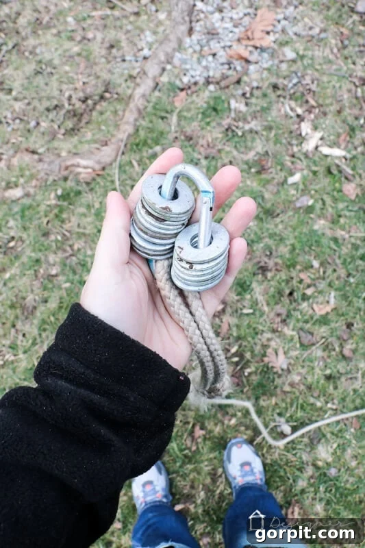 Close-up of rope draped over a thick tree branch, showing the secure setup for the swing.