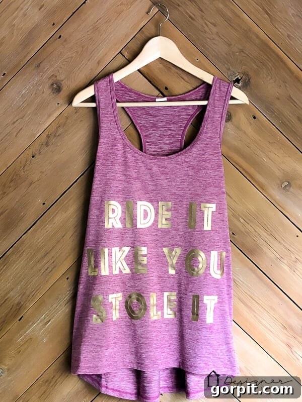 Proudly wearing a custom workout shirt made with Cricut SportFlex Iron On, showcasing its flexibility and fun design.