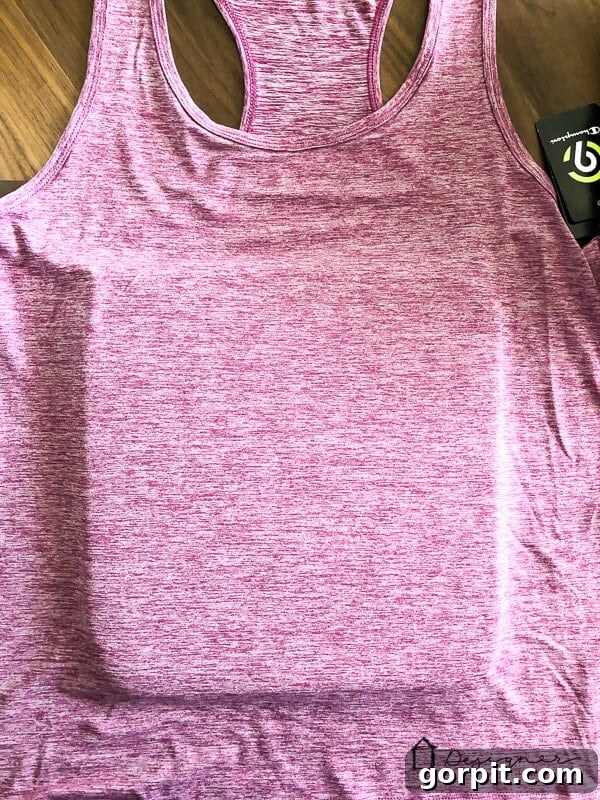 Preparing the workspace: placing the shirt on the Cricut EasyPress Mat and preheating the EasyPress to 305°F for SportFlex Iron On application.
