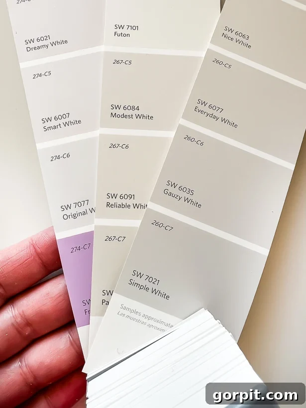 Image demonstrating how to identify a purple undertone in white paint by looking at the darkest hue on the swatch.