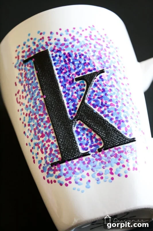 Washable Sharpie mug design in progress with layered dots.