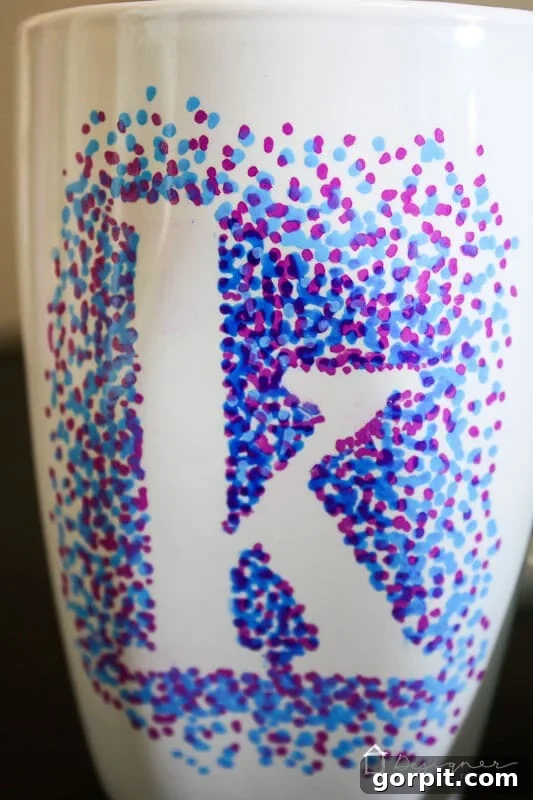 A finished dotted Sharpie mug, ready for use or gifting.