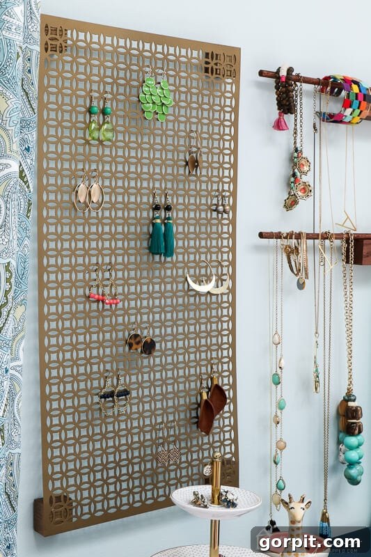 Tangle-Free Treasures: Easy DIY Jewelry Organization 14 Close-up of necklaces and bracelets hanging neatly on the DIY organizer's dowel rods.