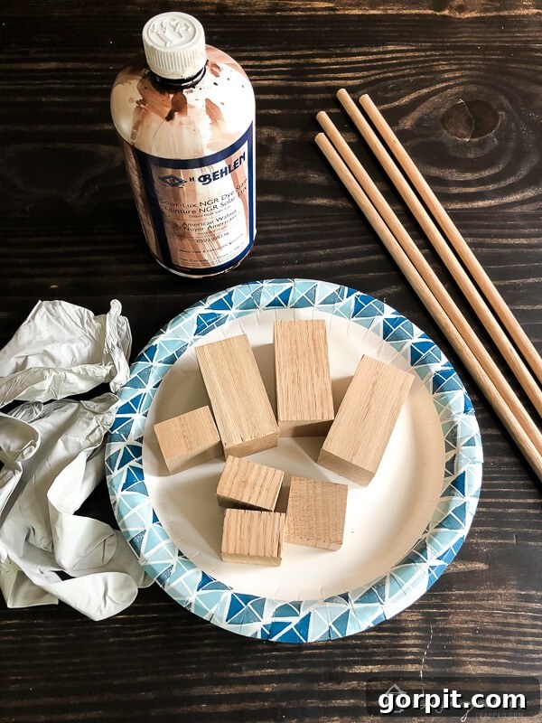 Tangle-Free Treasures: Easy DIY Jewelry Organization 5 Close-up of stained wood blocks and a container of Behlen Solar-Lux stain.