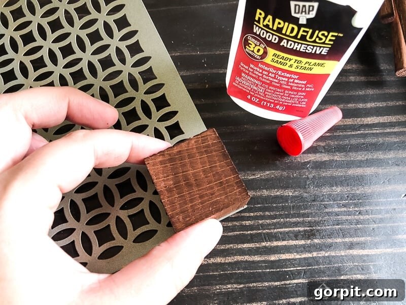 Tangle-Free Treasures: Easy DIY Jewelry Organization 7 Wood block being clamped to the corner of an aluminum sheet.