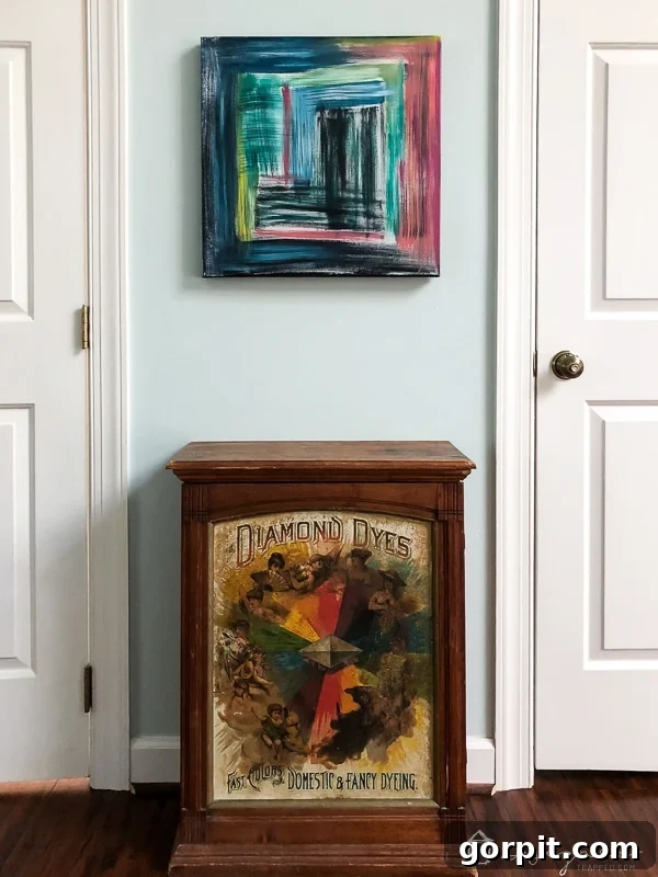 After: DIY abstract painting beautifully covering the wall fixtures