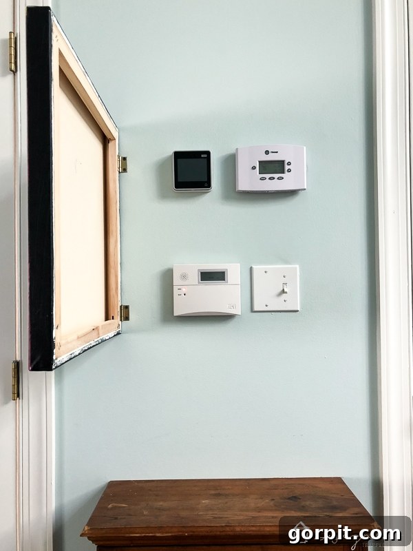 Close-up of DIY abstract art cleverly hiding a wall thermostat