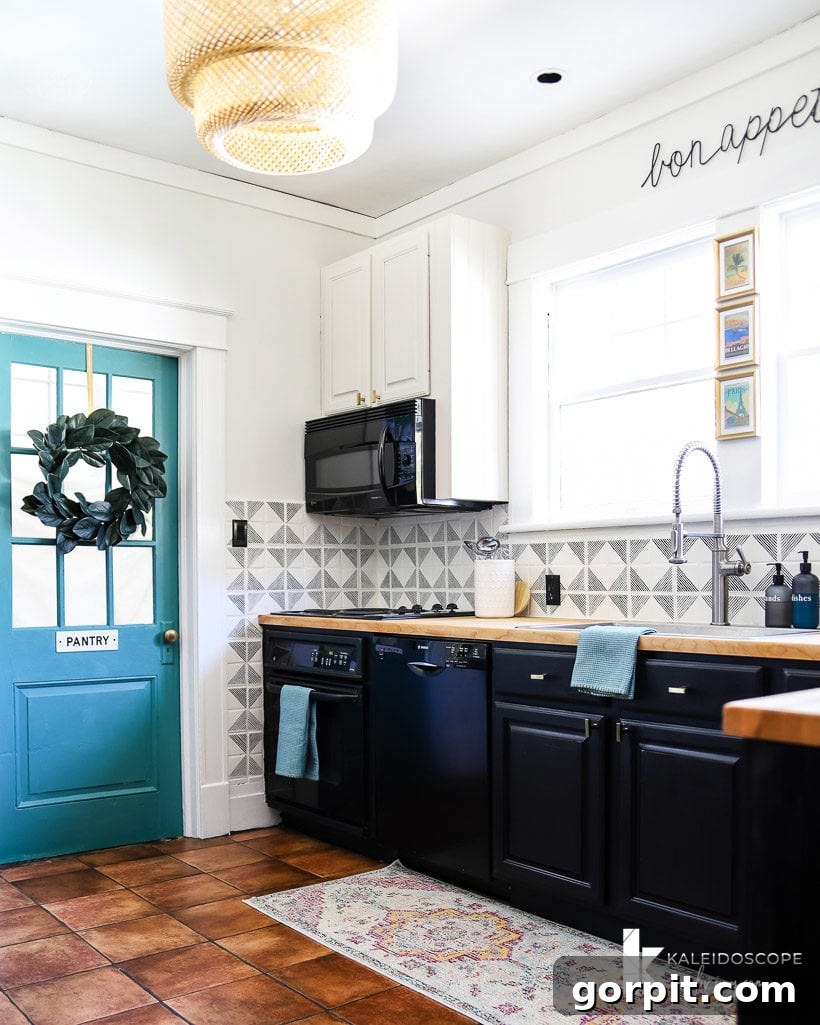 A kitchen designed around a colorful runner, showcasing cohesive color choices.