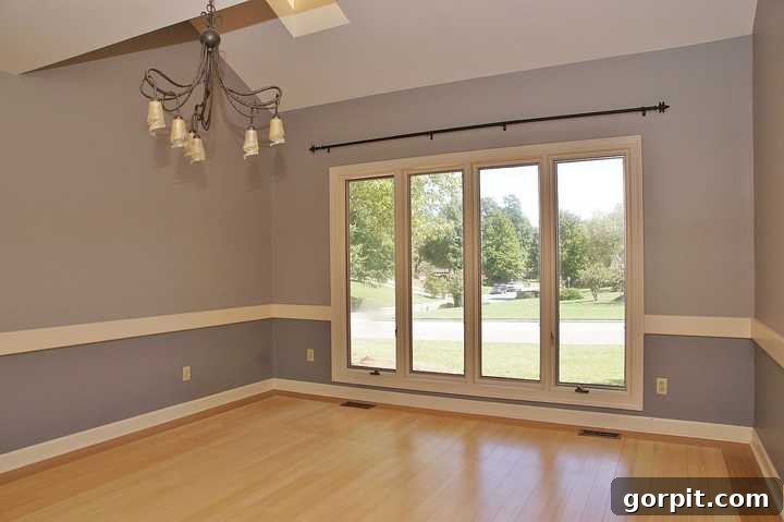 Outdated dining room with poorly hung curtains, showing the original window size.