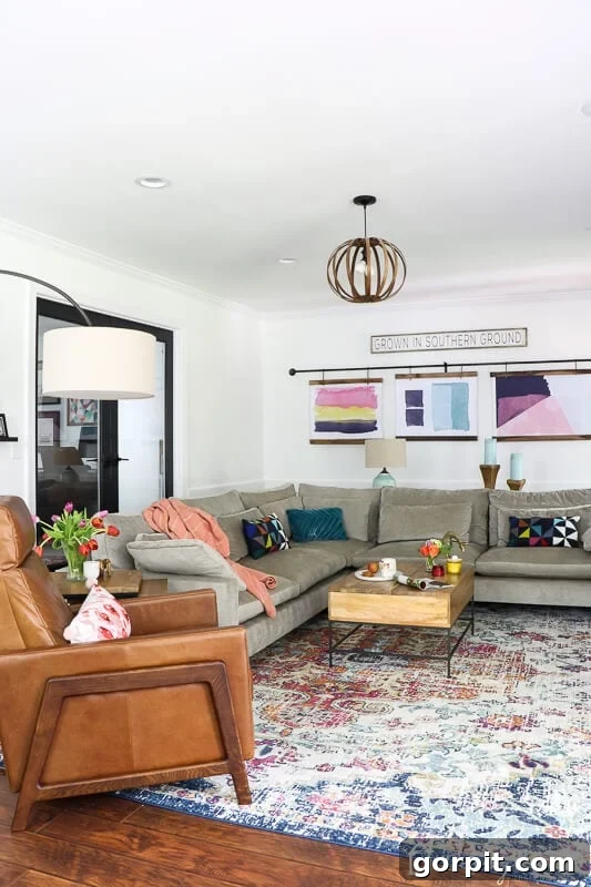 5 Habits That Keep Homes Beautiful 4 Family room showcasing a cohesive color palette with accent navy elements, contributing to a harmonious home design.