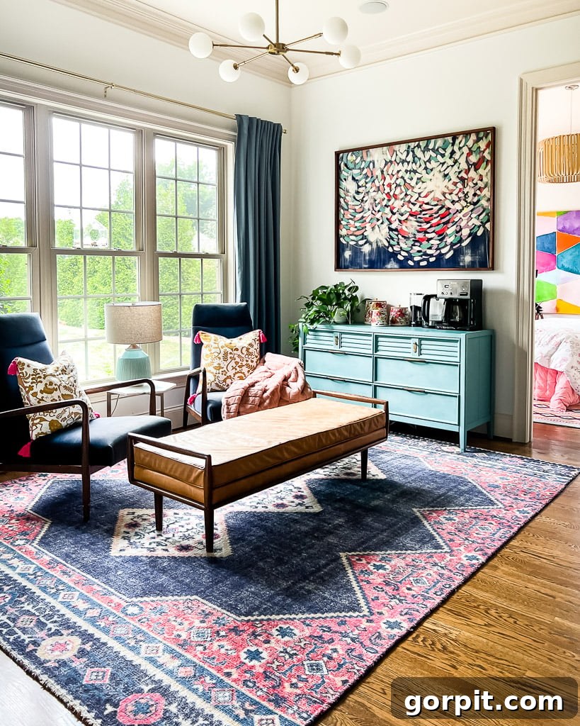 Velvet navy blue accent chairs in a casual sitting area, with colorful canisters on a blue dresser
