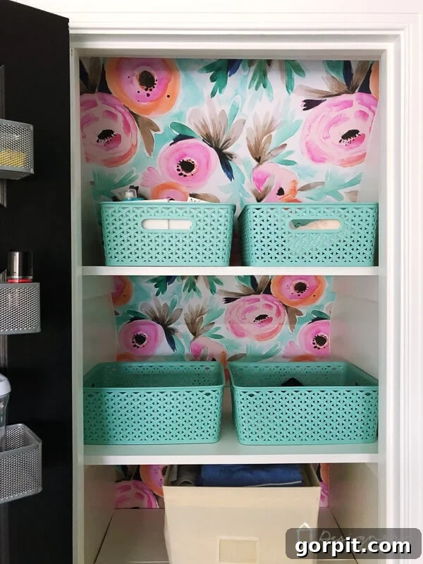 Wallpaper in a linen closet, showcasing a bold, colorful floral pattern