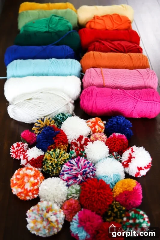 Selection of colorful yarn pom poms for DIY wreath