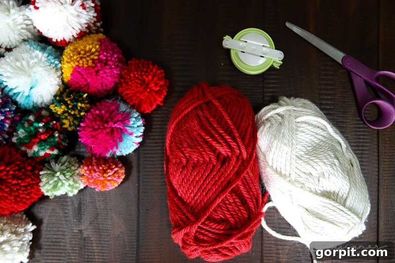 Variety of fluffy yarn pom poms in different colors and textures