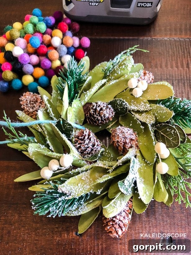 Mini wreaths can be such a cute and festive touch when decorating for Christmas. We added mini wreaths to our kitchen cabinets this year, and they are my new favorite thing! In this post, I share how we customized and hung our mini wreaths, plus I've rounded up the cutest mini wreaths out there that you can buy! #christmasdecor #miniwreaths #christmaswreaths #christmasdecorations #wreath #wreaths