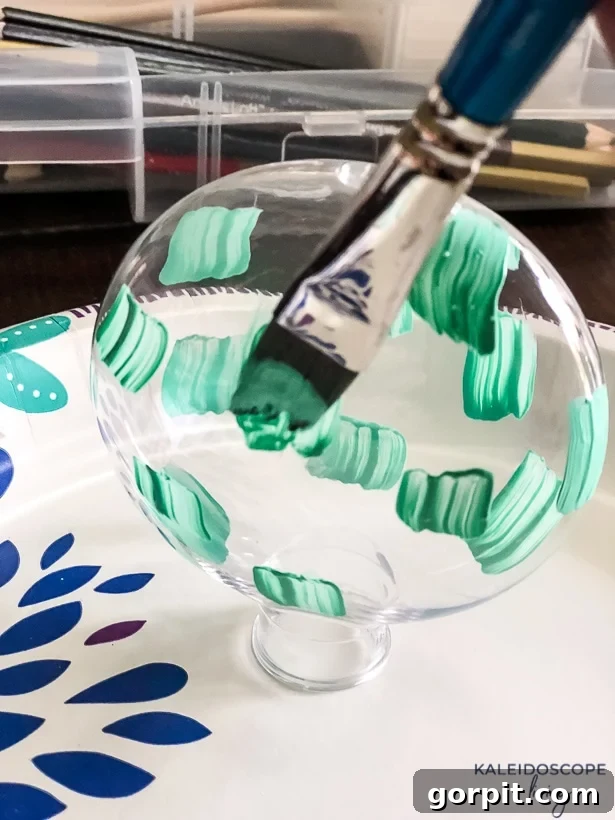 Crafting Unique Painted Holiday Treasures 4 First layer of brush marks on a plastic Christmas ornament
